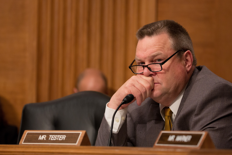 U.S. Sen. Jon Tester (D-MT) listens to Treasury Secretary Steven Mnuchin at a Senate Banking Committee and International Policy hearing on Capital Hill May 18, 2017 in Washington, DC. Mnuchin spoke before the committee that oversees bank regulations in his first congressional testimony since being named as Treasury secretary.